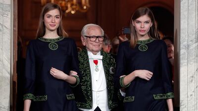Pierre Cardin acknowledges applause after a show to mark 70 years of his creations, in Paris in November 2016. AP