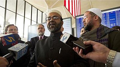 Flanked by supporters, Masudur Rahman, centre, and Mohamed Zaghloul speak to the media at Memphis International Airport on Monday.