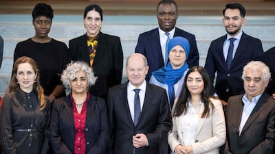 German Chancellor Olaf Scholz, centre, and his integration chief Reem Alabali-Radovan, second right, met minority and migrant leaders at the chancellery in Berlin. AFP