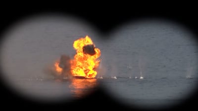 An image from the IRGC's website shows a military drill in the Arabian Gulf on Monday. EPA