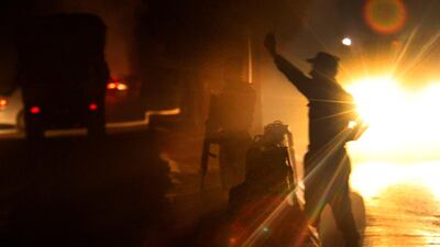 An Afghan security official inspects the scene of a suicide car bomb attack in Afghanistan's Kabul on 24 December 2018. EPA