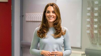 She paired the look with high-waist black trousers and heeled pumps. AFP