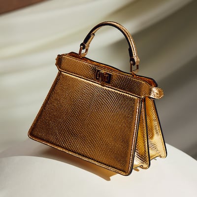 Fendi's 2024 Ramadan collection includes new variations of the brand’s Peekaboo bag in laminated gold. Photo: Fendi.