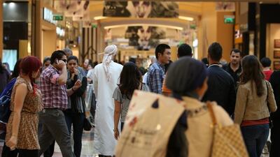 Young Emiratis say wearing national dress is a source of pride. Pawan Singh / The National