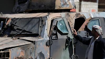 A man looks at an armoured personnel carrier damaged during recent clashes between Houthi fighters and forces loyal to Yemen's former president Ali Abdullah Saleh in Sanaa, Yemen December 5, 2017. Khaled Abdullah / Reuters