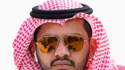 Members of the media and arrival teams are reflected in the glasses of an official photographer as they wait for the arrival of US Secretary of State Mike Pompeo in Riyadh. AFP