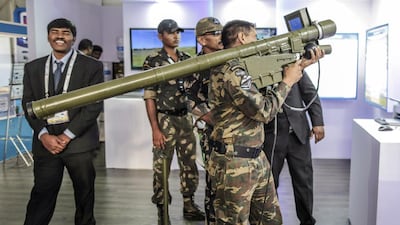 A military professional tries out a Zen Technologies anti-aircraft air defence simulator during a defence exhibition. The company plans to increase its exports business. Dhiraj Singh / Bloomberg