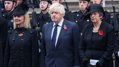 Ms May with fellow former prime ministers Liz Truss and Boris Johnson during the National Service of Remembrance at The Cenotaph in November 2023 in London