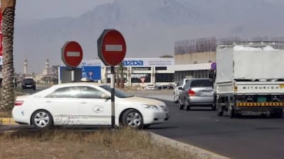 Cars doing a U-turn into fast-moving traffic on the E11 in RAK.