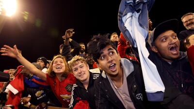 Fans cheers during a Manchester United during a training session at the WACA in Perth. EPA