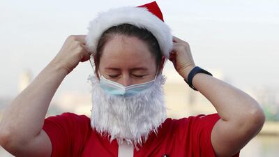 A runner attaches their beard before heading to the start line