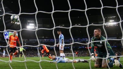 Manchester City's Ederson and teammates look dejected as Shakhtar Donetsk's Manor Solomon celebrates scoring. Reuters