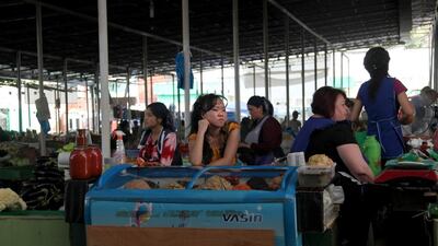 A young vendor waits for customers on a summer day this year in the Green Market of Dushanbe, the capital of Tajikistan. Getty Images