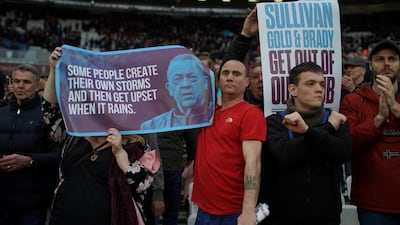 West Ham United fans hold up banners protesting against the board. David Klein / Reuters