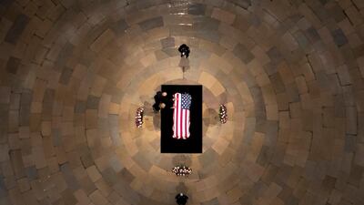 Democratic presidential candidate Joe Biden and his wife Jill Biden touch the flag-draped casket of the late House Representative John Lewis, as he lies in state at the Capitol in Washington. AP Photo