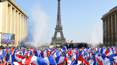 French far-right Reconquete! party president and presidential candidate Eric Zemmour, centre, stands with supporters and allies on stage at a campaign rally in Paris. AFP
