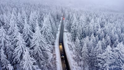 Cars make their way through a wintry landscape near Frankfurt, Germany. AP
