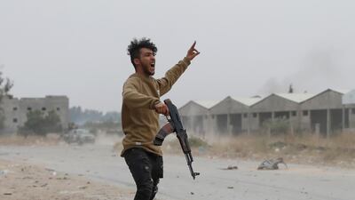 A GNA fighter gestures in the open. Reuters
