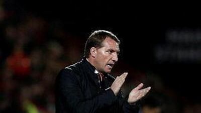Liverpool manager Brendan Rodgers applauds on the touchline during the English League Cup quarter-final football match between Bournemouth and Liverpool at Goldsands Stadium in Bournemouth, southern England, on December 17, 2014. AFP PHOTO / ADRIAN DENNIS