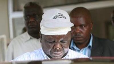Zimbabwe's Prime Minister, Morgan Tsvangirai, center, is discharged from hospital in Harare a day after a car crash killed his wife.