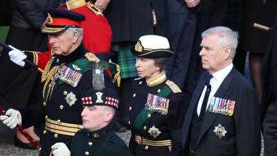 King Charles, Princess Anne and Prince Andrew walk behind the hearse. Reuters
