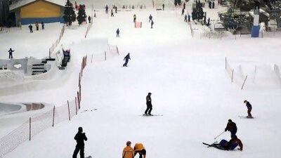 Indoor ski slopes, bowling alleys, rock-climbing walls and shark-infested aquariums are features of the mall experience. Galen Clarke / The National