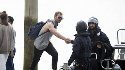 Family member thanks the Police National Dive Squad near White Island in Whakatane, New Zealand. Getty Images