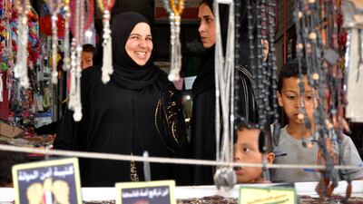 Women and children choose ornaments at a market in Syria's north-eastern city of Hasakeh. AFP