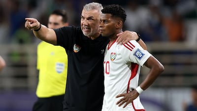 UAE coach Cosmin Olaroiu with Yahya Al Ghassani during the World Cup qualifier against Uzbekistan at the Al Nahyan Stadium in Abu Dhabi. Chris Whiteoak / The National
