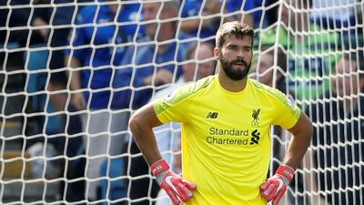 Alisson looks dejected after Leicester City pounced on the Liverpool goalkeeper's mistake to claw back a goal. Reuters