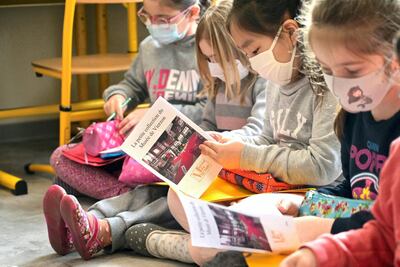 Children study works of arts at the Tunnel-Chateau school in Vierzon, central France. AFP