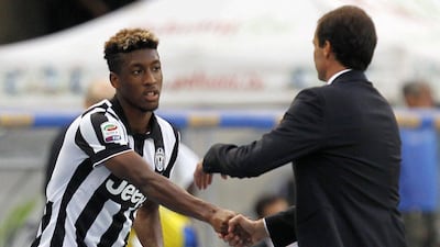 Juventus' Kingsley Coman shakes hands with his coach Max Allegri during their Serie A win over Chievo Verona on Saturday. Alessandro Garofalo / Reuters / August 30, 2014