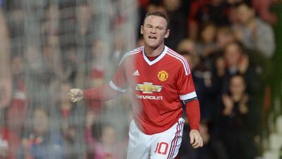Manchester United's Wayne Rooney celebrates the opening goal on Wednesday night, his first of the season for United, against Ipswich Town. Oli Scarff / AFP