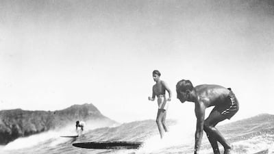 Surfing has long inspired a nearly spiritual level of commitment to the sport in the face of frequently considerable danger. Transcendental Graphics / Getty Images