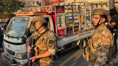A lorry carrying weapons handed over by Palestinian factions. AP