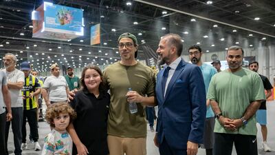 Sheikh Mansour stands for a photograph while visiting Abu Dhabi Summer Sports. Photo: Presidential Court
