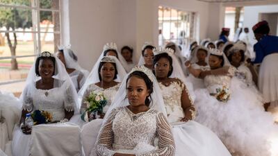 A group of brides at the International Pentecostal Holiness Church south of Johannesburg wait to take part in a mass wedding ceremony on Easter Sunday. AFP