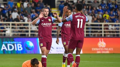 Aston Villa's John McGinn, left, celebrates with teammates after scoring the winner against Chelsea. AFP