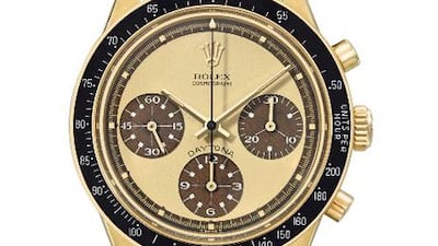 The 18K gold chronograph wristwatch with tropical lemon dial and white numerals, Rolex Daytona, Paul Newman model, reference 6264, from circa 1970. Courtesy Christie’s