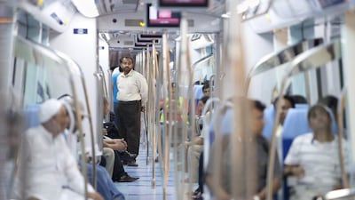 People ride the train of the Dubai Metro's Green Line. Jaime Puebla / The National