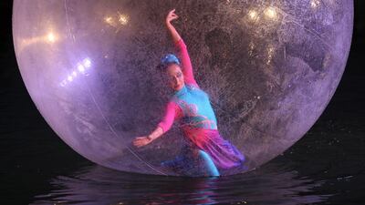 A dancer performs during a display of water acrobatics on Thursday night as part of the Sharjah Aquarium Carnival. Five-year-old Egyptian visitor Rana Ahmed, watching the performance, said: ‘She was like a beautiful mermaid.’ Pawan Singh / The National