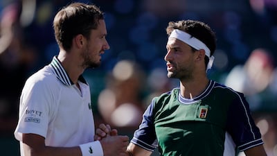 Grigor Dimitrov, right, shakes hands with Daniil Medvedev after their match at the BNP Paribas Open. AP Photo