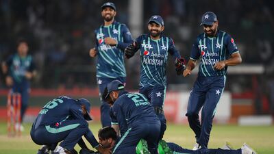Usman Qadir of Pakistan is congratulated by teammates after taking the catch that dismissed Alex Hales. Getty