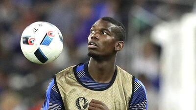 France midfielder Paul Pogba warms up at half time at the Stade Velodrome. Ariel Schalit / AP Photo
