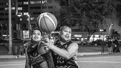 Justin Sertimo, left, and Jayectin Apipe fight for the rebound.