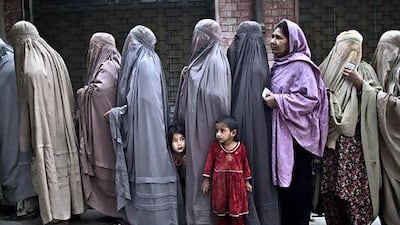 Pakistani women queue at a polling station on the outskirts of Islamabad. Muhammed Muheisen / AP Photo