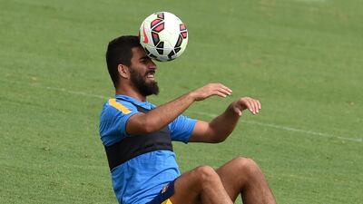 Barcelona's Arda Turan heads the ball during a training session in Los Angeles on Monday. Mark Ralston / AFP / July 20, 2015