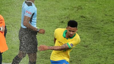 Gabriel Jesus makes his way off the pitch and kicks a water bottle. Reuters