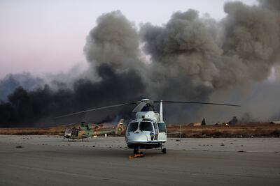 Smoke rises in the aftermath of suspected Israeli strikes near Mezzeh Airbase in Damascus. Getty Images
