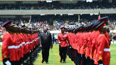 Outgoing Kenyan President Uhuru Kenyatta inspects a guard of honour at the Moi International Sports Centre Kasarani in Nairobi ahead of William Ruto's inauguration ceremony. AFP